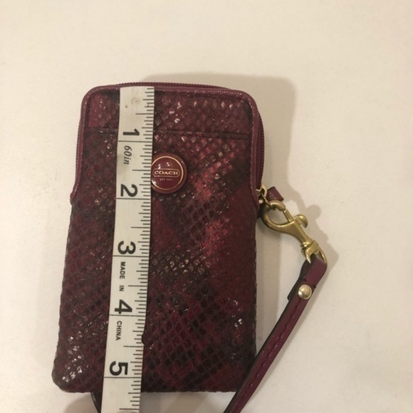 Coach pink python embossed wristlet bag